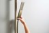 Bild von HANSGROHE Unica Shower bar E Puro 65 cm with easy slide hand shower holder and Isiflex shower hose 160 cm Brushed Bronze 24404140